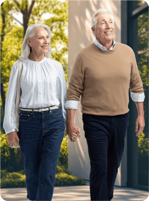 Elder couple holding hands.